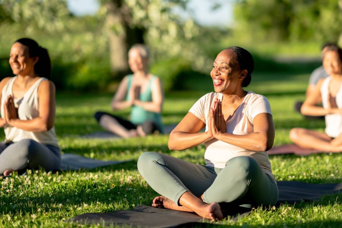 Health and wellness professionals in Sydney leading an outdoor yoga session, promoting balance, relaxation, and healthy living.
